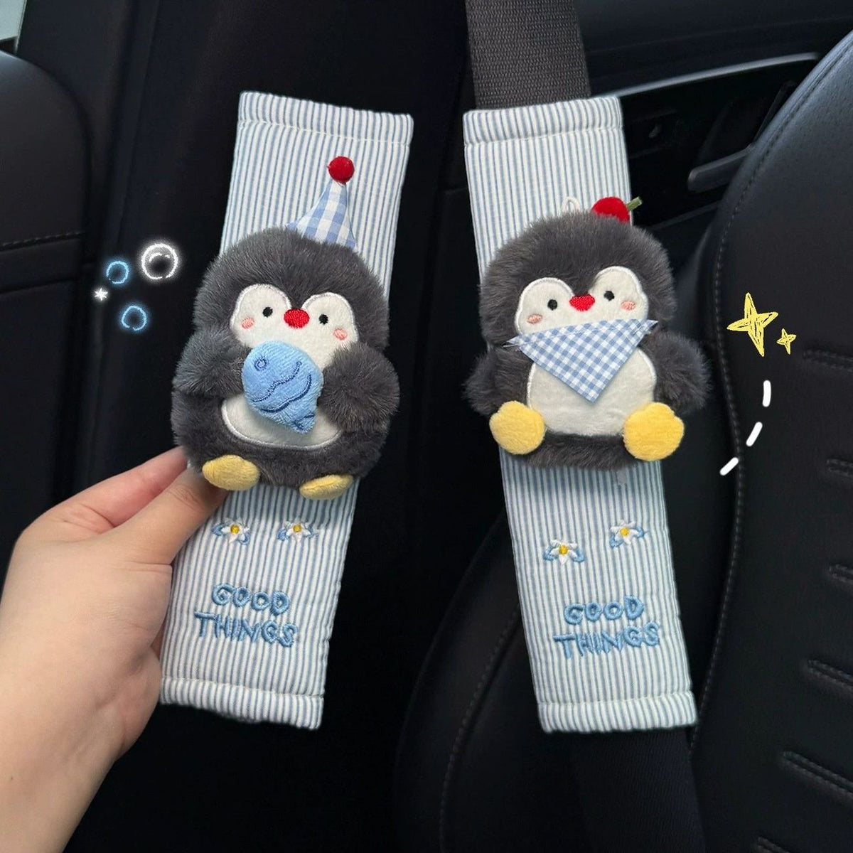 Close-up view of plush penguin decorations and embroidered stripes.