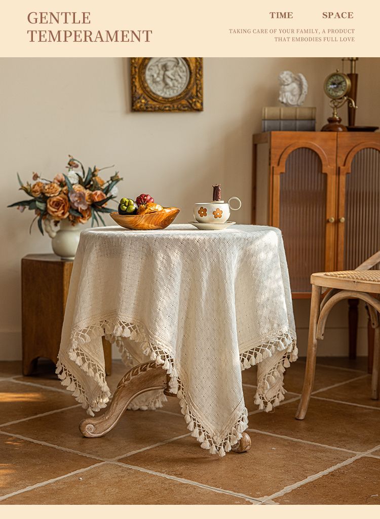 Round table styled with the beige fringed tablecloth