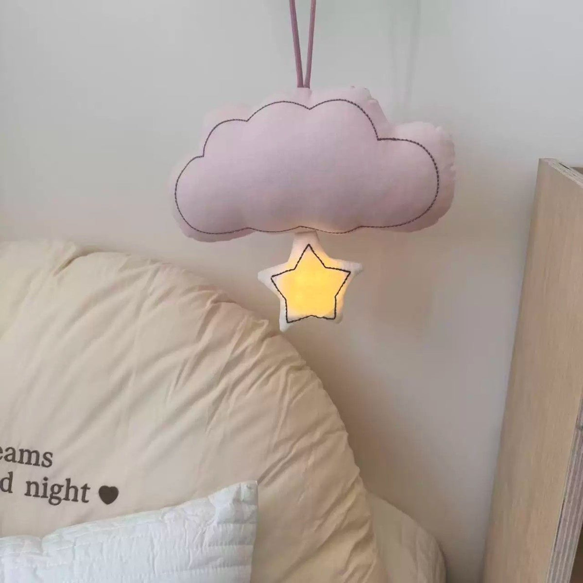 Rose pink hanging cloud night light with illuminated star