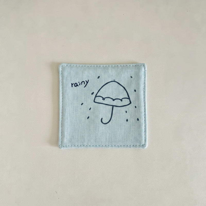 Light blue cotton-linen coaster with a rainy umbrella print.
