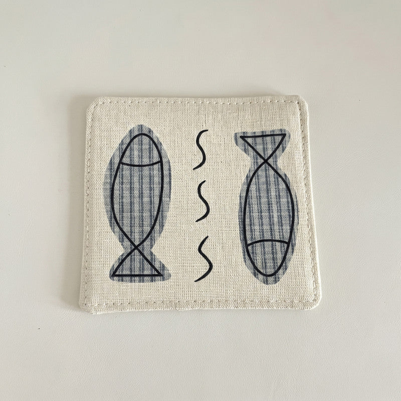 Natural cotton-linen coaster with two fish illustrations.