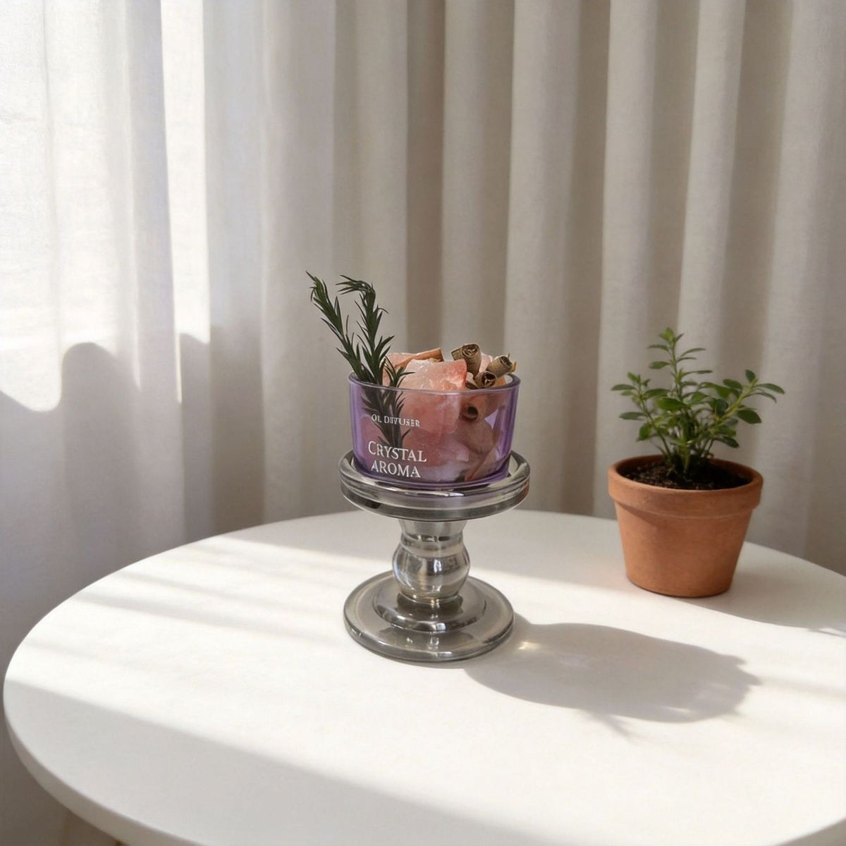 Purple crystal diffuser bowl on a pedestal base beside a potted plant