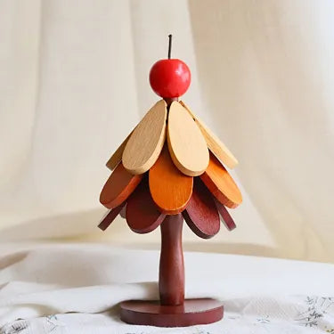 Apple topper three layer wooden Christmas tree trivet on a table