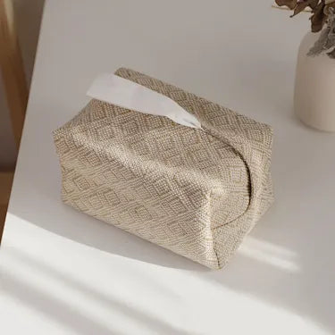 Single diamond-texture fabric tissue box cover on a table