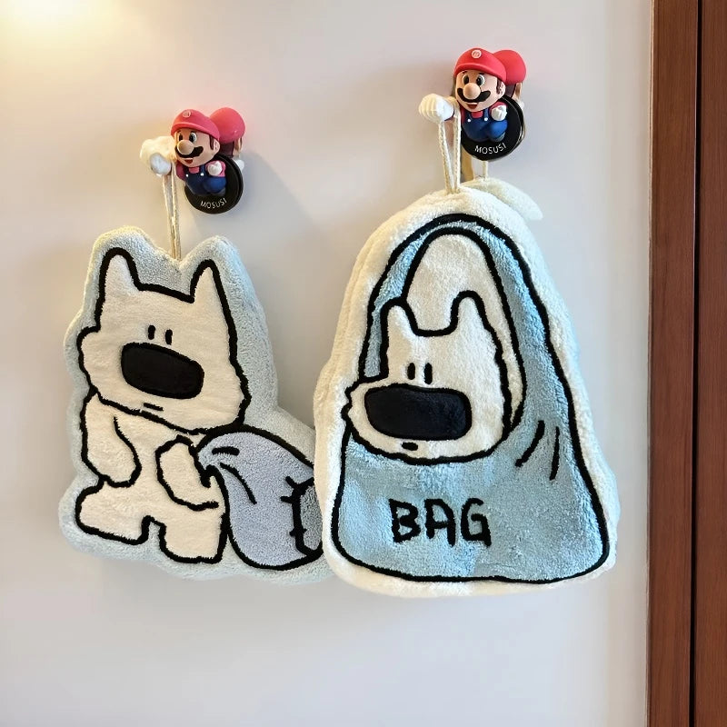 Hanging dog hand towel displayed beside a sink