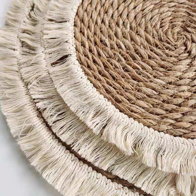 Detail of braided straw and fringe on round woven mat