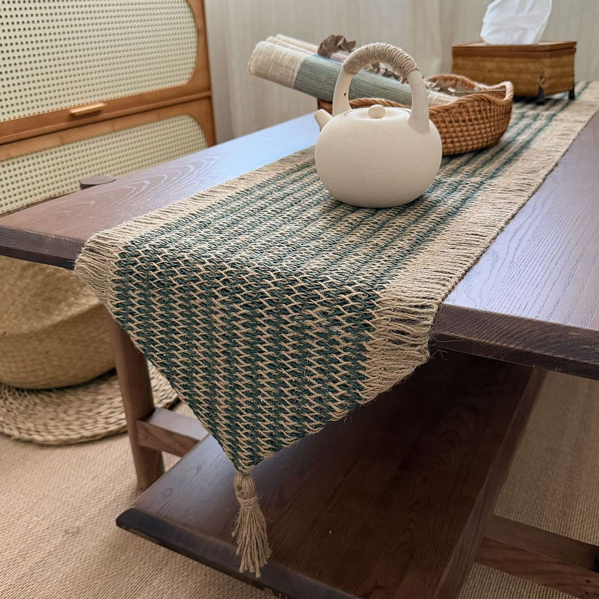 Side view showing the runner's woven design and tassel finish