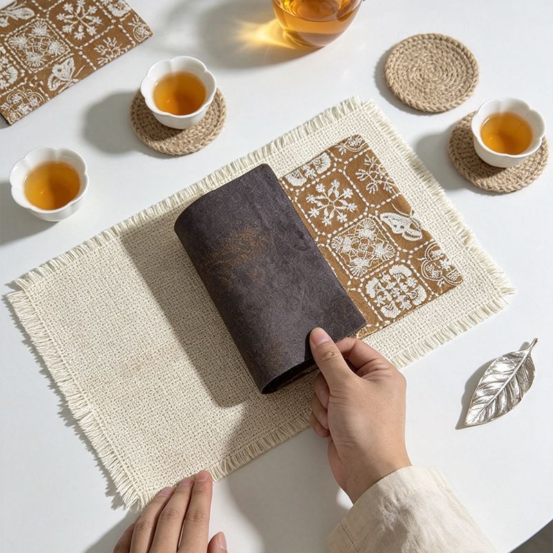 Cotton-linen tea mat with brown pattern on a tea table